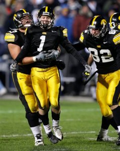 Iowa kicker Daniel Murray (1) and two teammates after their game-winning field goal. 24-23 ... with one friggin' second left. Argh.
